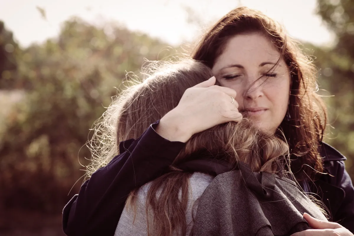 Two women hugging | Source: Unsplash