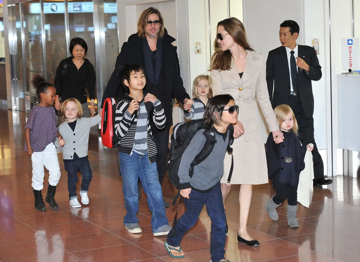 Brad Pitt, Angelina Jolie and their six children at Haneda International Airport on November 8, 2011 | Photo: Getty Images
