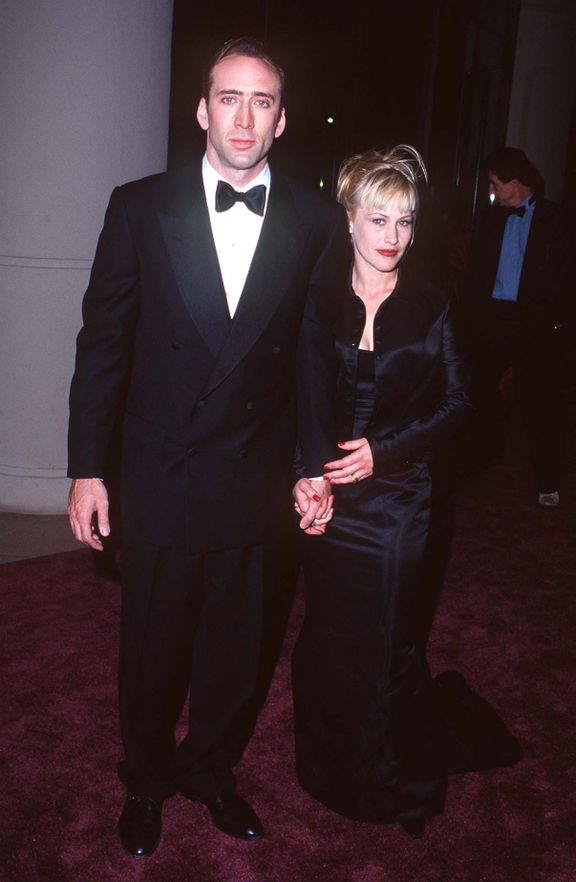 Patricia Arquette y Nicolas Cage durante los honores del American Film Institute a Clint Eastwood con el premio Life Achievement 1996. | Foto: Getty Images