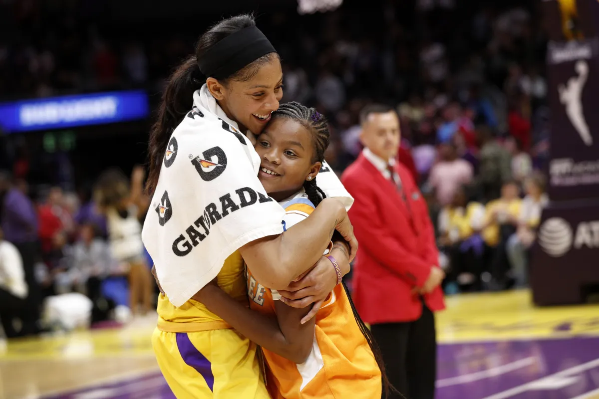 WNBA star Candace Parker hugs her daughter Lailaa Nicole Williams, after winning the game against the Phoenix Mercury in 2019. | Photo: Getty Images