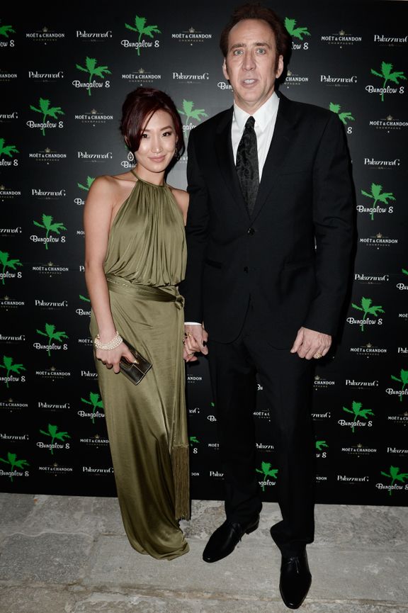 Alice Kim y Nicolas Cage asisten a "Bungalow 8 Pop Up en el Festival de Cine de Venecia", el 30 de agosto de 2013. | Foto: Getty Images