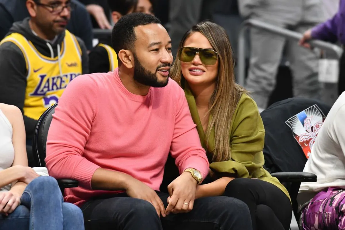 John Legend and Chrissy Teigen at a basketball game between the Los Angeles Clippers and the Los Angeles Lakers on March 08, 2020. | Photo: Getty Images