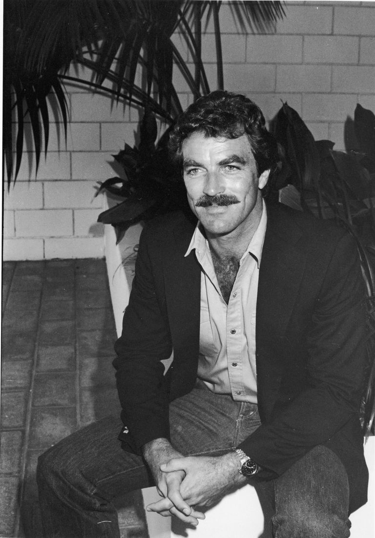 Tom Selleck sits on a patio during a brunch at the Beverly Hilton Hotel, Beverly Hills, California, July 1981.